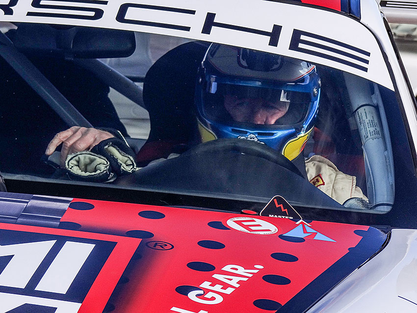 Zwart in his Porsche GT3 Cup car grabs his gloves before the start of his 2014 run. (Photo by Sean Cridland.)